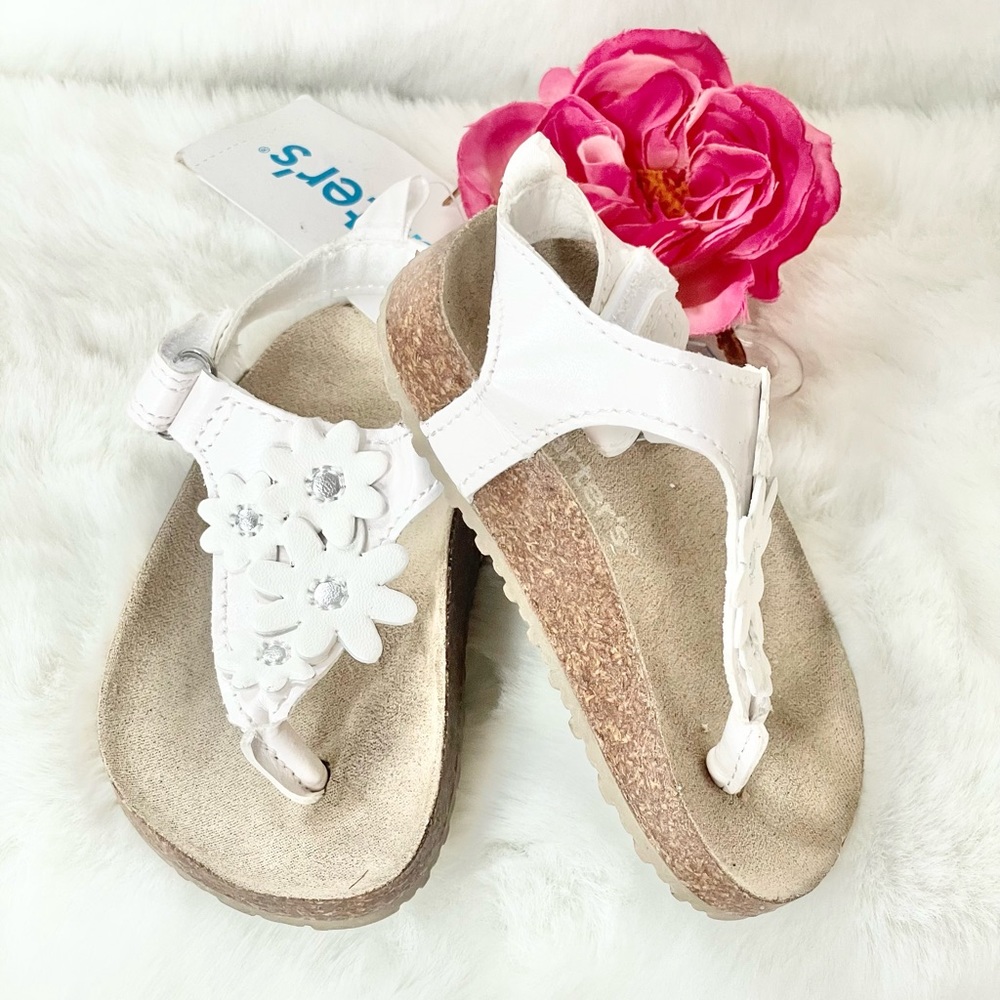 New with tags CARTER’S Toddler’s white Sandals with White Floral Design. Velcro